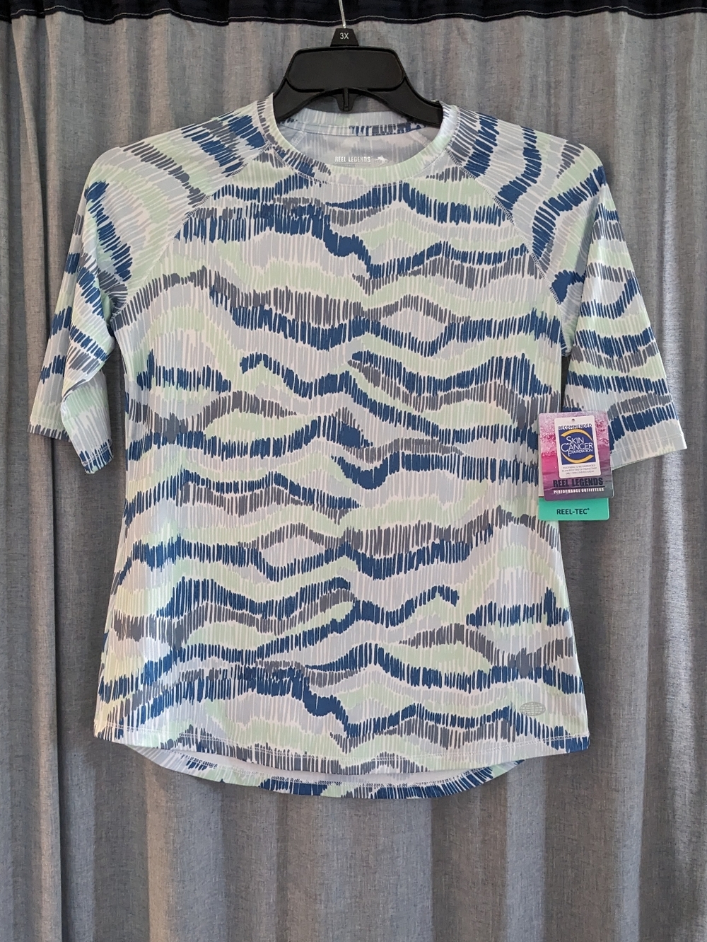 NWT Reel Legends Reel Tec Shirt Womens S Linear Waves Blue Short Sleeve UPF 50